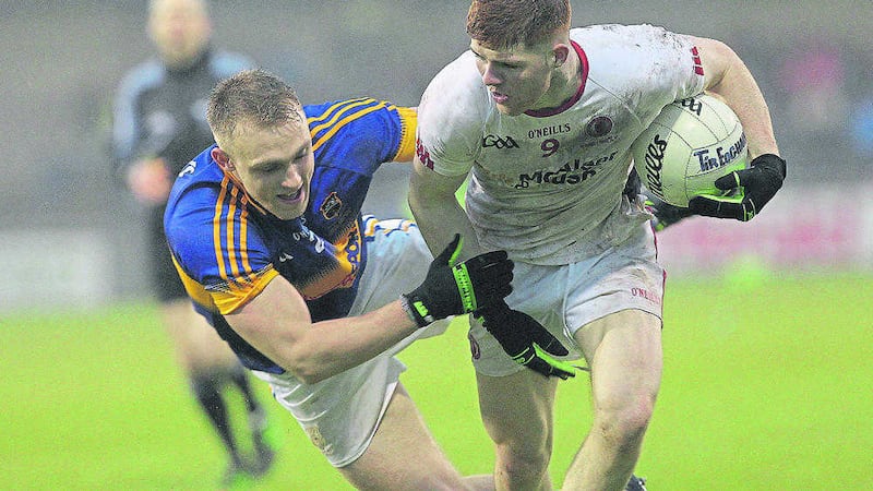 Cathal McShane powers past Tipperary's Kevin Fahey during last year's All-Ireland U21 Football Championship final