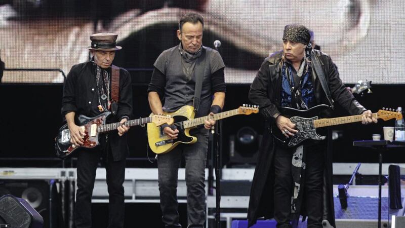 Stevie Van Zandt in his trademark headscarf plays alongside Bruce Springsteen to a full house at Croke Park. Picture by Matt Bohill 