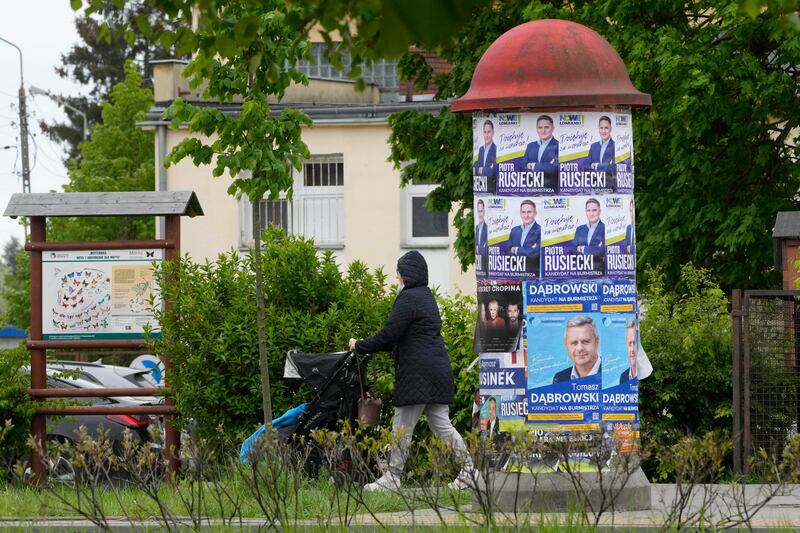 Campaign posters promote candidates as Poles vote in local and regional elections in Lomianki, near Warsaw (Czarek Sokolowski/AP)