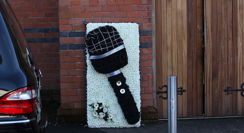 A wreath depicting a microphone at Michael Cullen's funeral. Picture by Ann McManus
