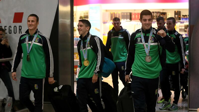 Boxers Michael O'Reilly, left, Michael Conlan and Joe Ward return to Dublin Airport &nbsp;