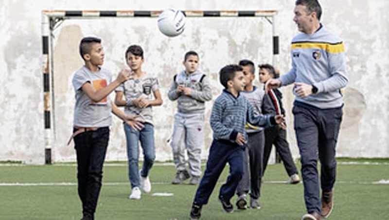Ois&iacute;n McConville gives a Gaelic football skills training session to young Palestinian refugees in the Aida refugee camp in Bethlehem 
