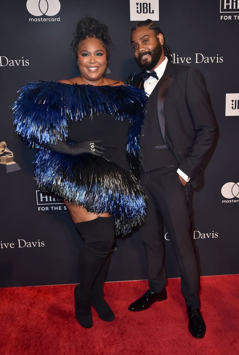 Lizzo and Myke Wright arrive at the Pre-Grammy Gala at the Beverly Hilton hotel in Beverly Hills, California