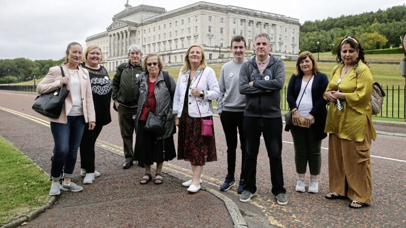 Fergus Dowd, third from right, at Stormont with former Debenhams workers who manned pickets in the Republic. Picture by Hugh Russell 