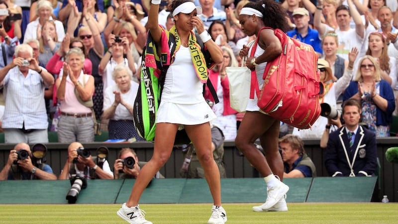 Heather Watson and Serena Williams leave centre court following their match on day Five of the Wimbledon Championships