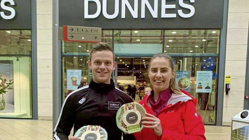Simply Fit Food co-founders Evelyn Garland and Luke Judge celebrate the supply deal with Dunne Stores 