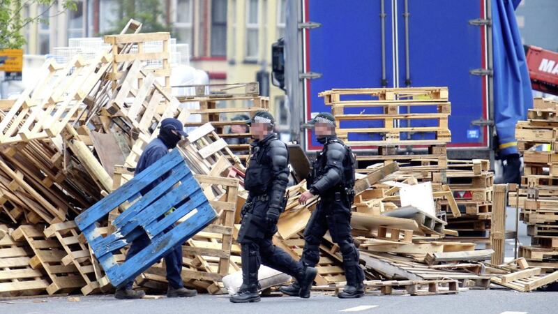 Police and contractors at Cluan Place in east Belfast to remove a loyalist bonfire. Picture by Mal McCann 