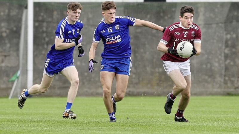 Slaughtneil&#39;s Conor McAllister with Joe Polley and Liam Connolly of Claudy during the Derry Senior Football Championship match at Dungiven on Sunday Picture: Margaret McLaughlin. 