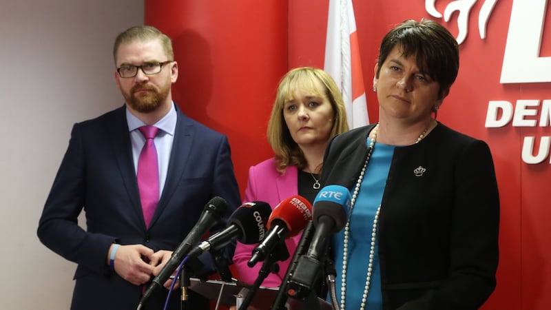 Simon Hamilton with DUP party members Michelle McIlveen and leader Arlene Foster. Picture by Niall Carson, Press Association&nbsp;