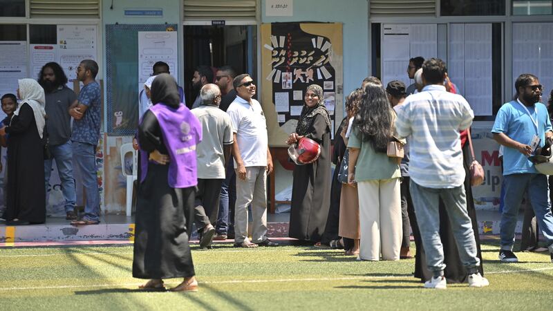 Maldivians queue to cast their votes in Male on Saturday (Mohamed Sharuhaan/AP/PA)