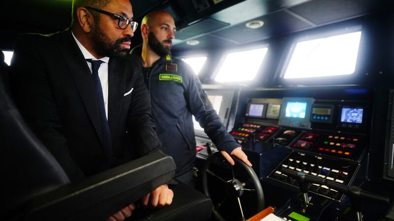 Home Secretary James Cleverly is shown a radar system during a tour of a police boat in Lampedusa Port