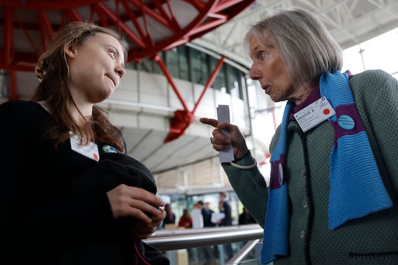 Swiss member of Senior Women for Climate Rosmarie Wydler-Walti talks to Swedish climate activist Greta Thunberg (Jean-Francois Badias/AP)