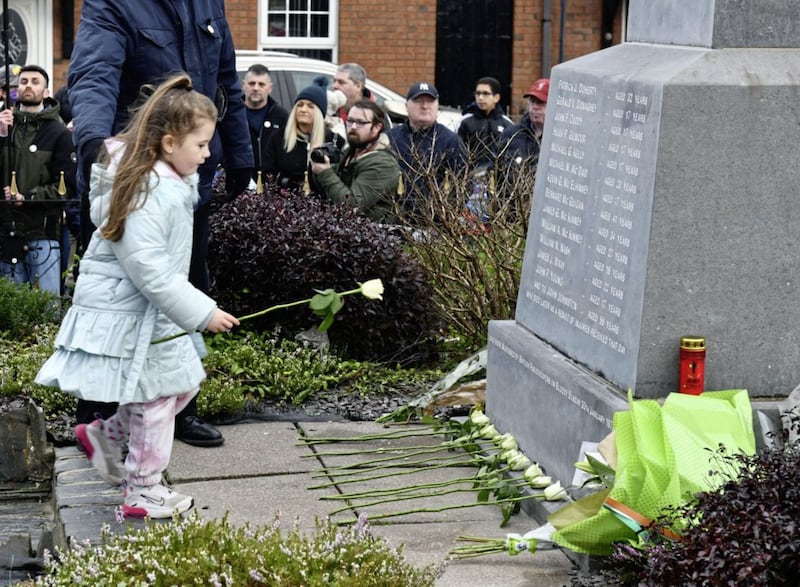 Family members laid flowers at the Bloody Sunday Memorial as thousands of people attended the 50th anniversary of the Bloody Sunday killings of 13 people in 1972. Picture by Alan Lewis. 