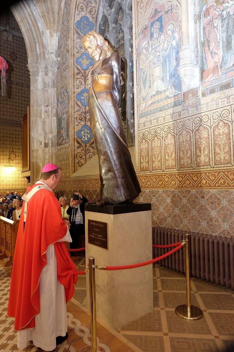 Archbishop Eamon Martin unveils the statue of St Oliver Plunkett in St Patrick's Cathedral, Armagh. Picture by LiamMcArdle.com