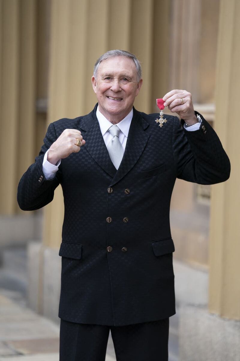 Boxer John H Stracey at investiture at Buckingham Palace
