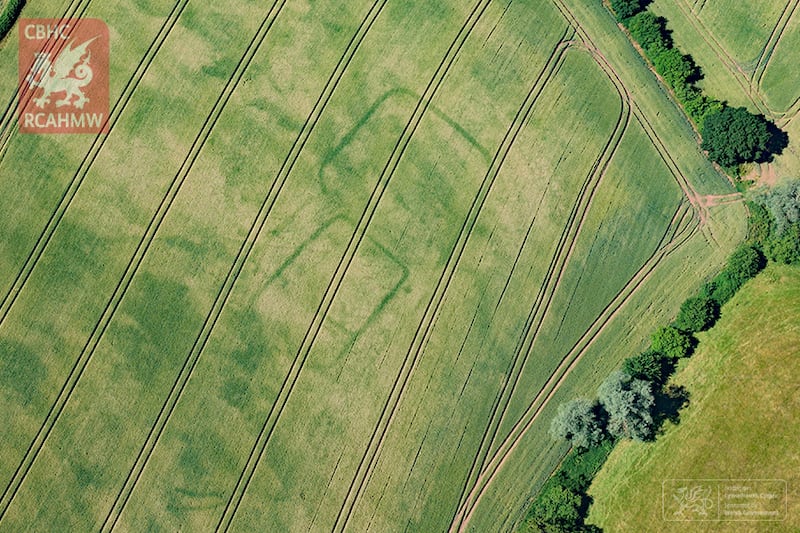 Newly discovered cropmarks of a prehistoric or Roman farm near Langstone, Newport, south Wales. (RCAHMW)