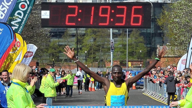 Kenya&#39;s Joel Kipsang Kositany takes the tape in Ormeau Park yesterday after winning the Belfast Marathon for the second time in three years 