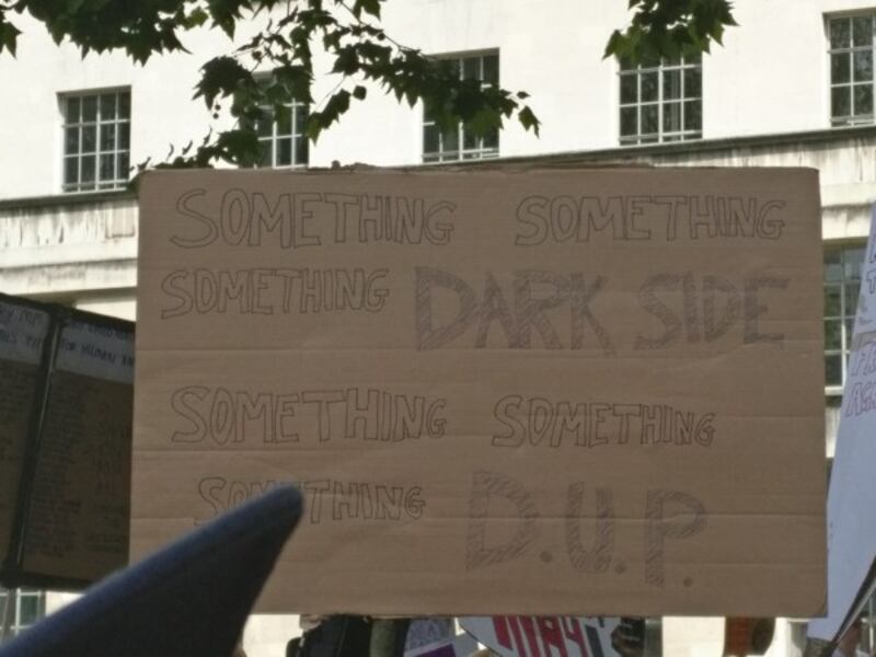 A sign at anti-Theresa May protests