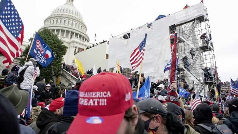 President Trump supporters climb at the West Front of the US Capitol in Washington 