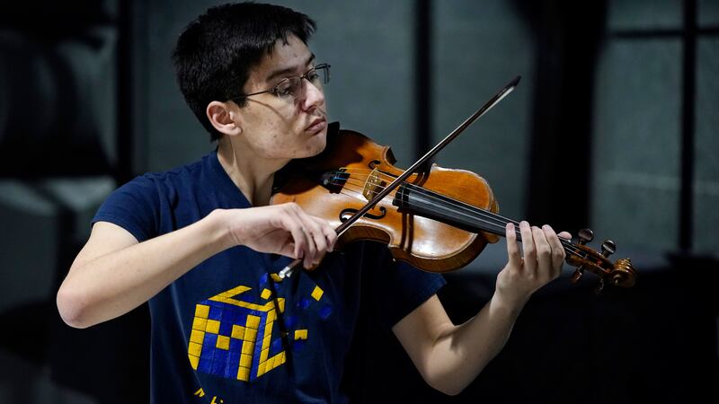 Student and accomplished violinist Stanley Chapel says the violin has aided in his speedcubing success.