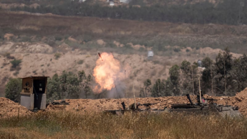 Israeli soldiers fire mortars from southern Israel towards the Gaza Strip (Ohad Zwigenberg/AP)