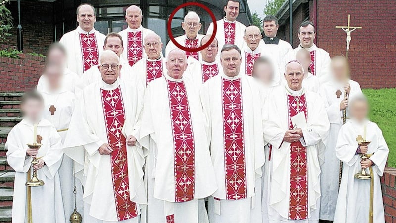 Fr Malachy Finegan, circled, pictured in 2000 with clergy including Dr John McAreavey and Canon Liam Stevenson. Picture courtesy of the Newry Reporter 