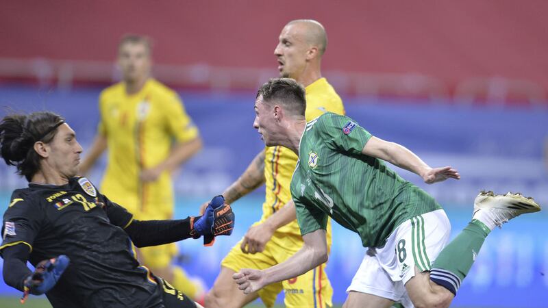 Northern Ireland's Gavin Whyte, right, scores his side's goal during the UEFA Nations League soccer match against Romania at the National Arena stadium in Bucharest, Romania on&nbsp;Friday September 4, 2020.<br />Picture by&nbsp;AP Photo/Alexandru Dobre