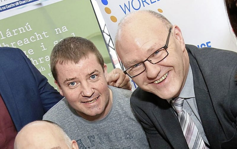 Sinn F&eacute;in councillor Ciaran Beattie, left, with the party&#39;s Westminster candidate for West Belfast Paul Maskey 