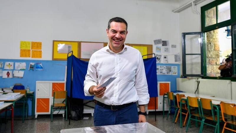 Alexis Tsipras, head of the left-wing Syriza party, votes at a polling station in Athens (Michael Varaklas/AP)