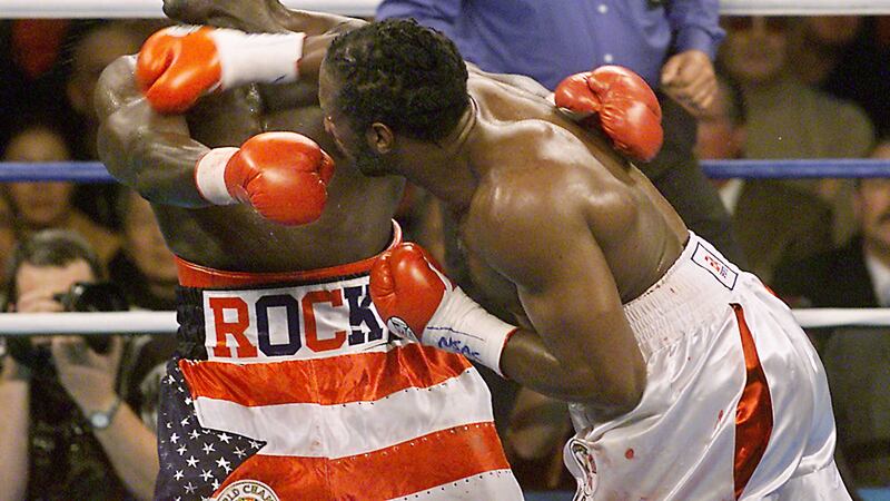 Lennox Lewis fires a pile-driving right hand to the head of Hasim Rahman in the fourth round of their WBC and IBF heavyweight title bout at the Mandalay Bay resort in Las Vegas on Saturday November 17 2001. Rahman recovered to sensationally KO Lewis but the latter exacted sweet revenge when they next met in 2004