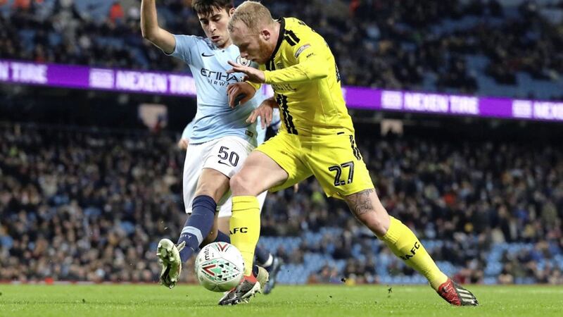 Burton Albion&#39;s Liam Boyce (right) and Manchester City&#39;s Eric Garcia battle for the ball during the Carabao Cup, semi final match at the Etihad Stadium, Manchester. PRESS ASSOCIATION Photo. Picture date: Wednesday January 9, 2019. See PA story SOCCER Man City. Photo credit should read: Martin Rickett/PA Wire. RESTRICTIONS: EDITORIAL USE ONLY No use with unauthorised audio, video, data, fixture lists, club/league logos or &quot;live&quot; services. Online in-match use limited to 120 images, no video emulation. No use in betting, games or single club/league/player publications. 