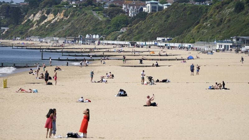 People enjoy the warm weather on Bournemouth beach in Dorset. Picture date: Wednesday May 24, 2023.