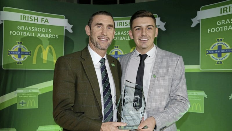 Corey Wilson, chairman of Braniel Football Club and 2018 &lsquo;Wes Gregg Coach of the Year&rsquo; winner, receiving his award from Martin Keown.<br /> Pic: Kelvin Boyes / Press Eye