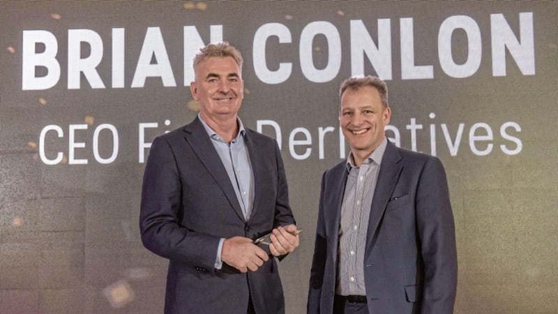 Brian Conlon (left) is presented with the Global Recognition award at the Digital DNA Awards by Jeremy Fitch (executive director at Invest NI) 