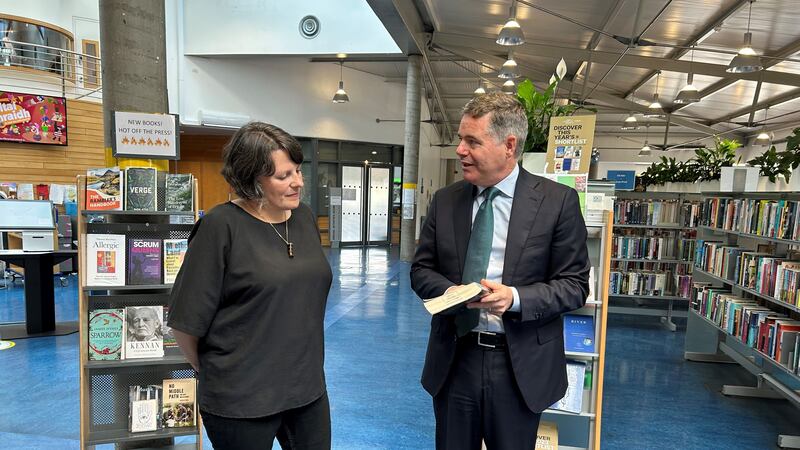 Librarian Clodagh Kingston speaks to Minister for Public Expenditure Paschal Donohoe at Cabra Library in Dublin (Cillian Sherlock/PA)