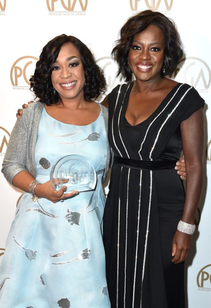 Viola Davis, right, and Shonda Rhimes, pose with the Norman Lear achievement award in television at the 27th annual Producers Guild Awards in 2016 (Jordan Strauss/Invision for Producers Guild of America/AP Images)