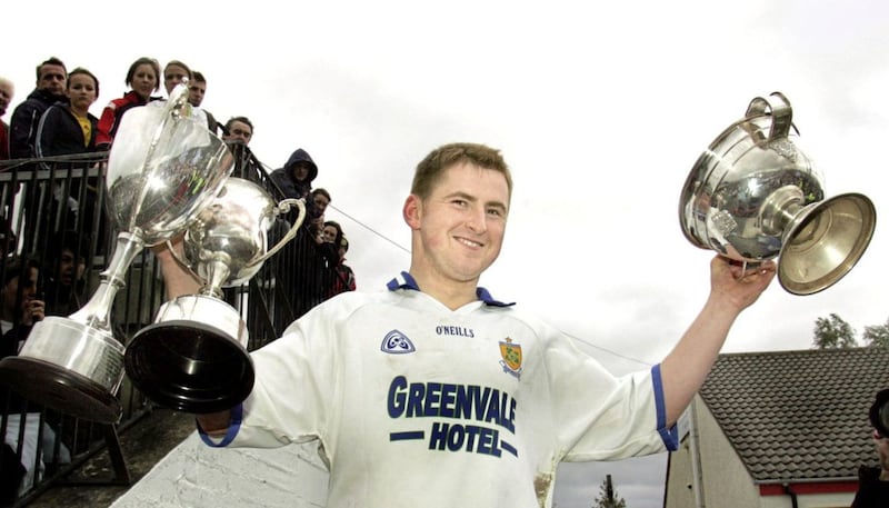 Ballinderry captain Conleith Gilligan lifts the Derry Senior Championship Cup, the man of the match cup and the championship top scorer cup (joint top scorer with Glenullin&#39;s Paddy Bradley) following their 2006 success. Picture by Margaret McLaughlin 