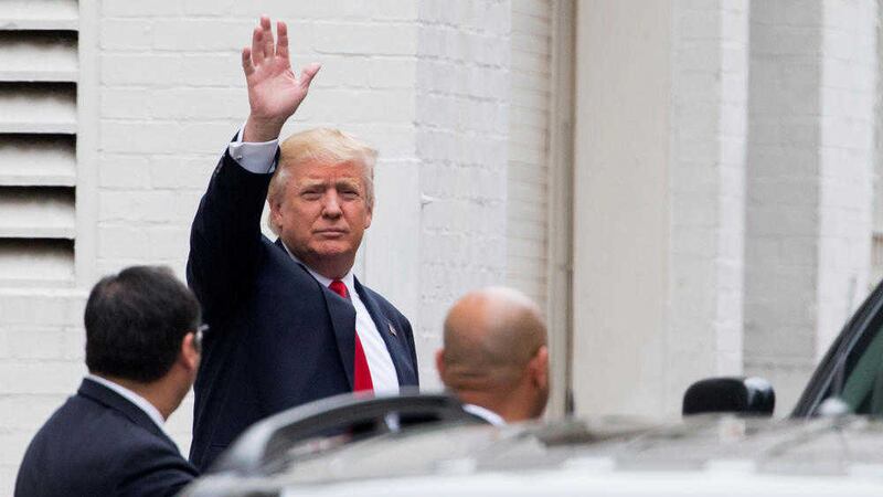 Republican presidential candidate Donald Trump waves as he arrives for a meeting with House speaker Paul Ryan at the Republican National Committee Headquarters on Capitol Hill in Washington PICTURE: Andrew Harnik/AP 