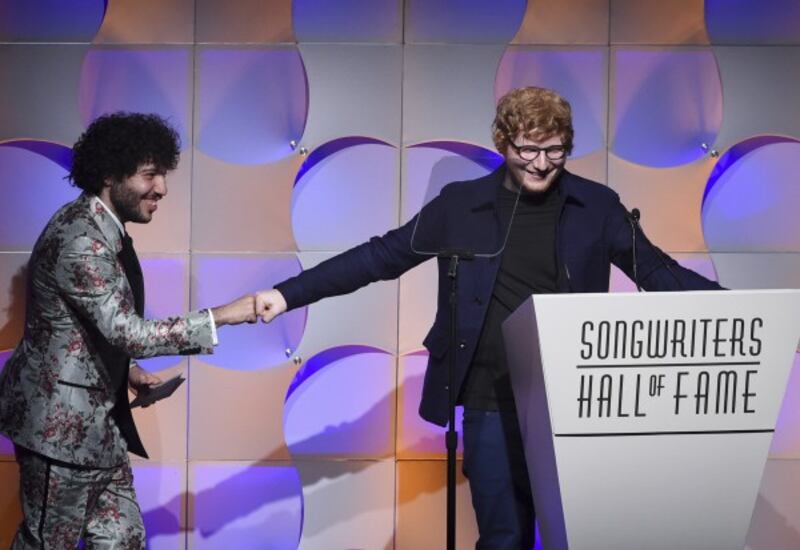 Ed Sheeran thanks his presenter, Benny Blanco, at the ceremony