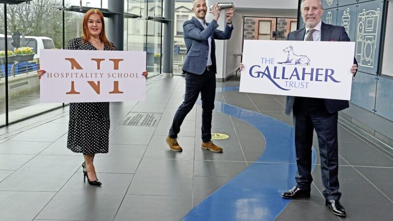 SHAKE ON IT: Announcing the launch of the Northern Ireland Hospitality School are Gallaher Trust chair Ian Paisley and Mid &amp; East Antrim Council chief executive Anne Donaghy with Northern Regional College lecturer Ashley Douglas 