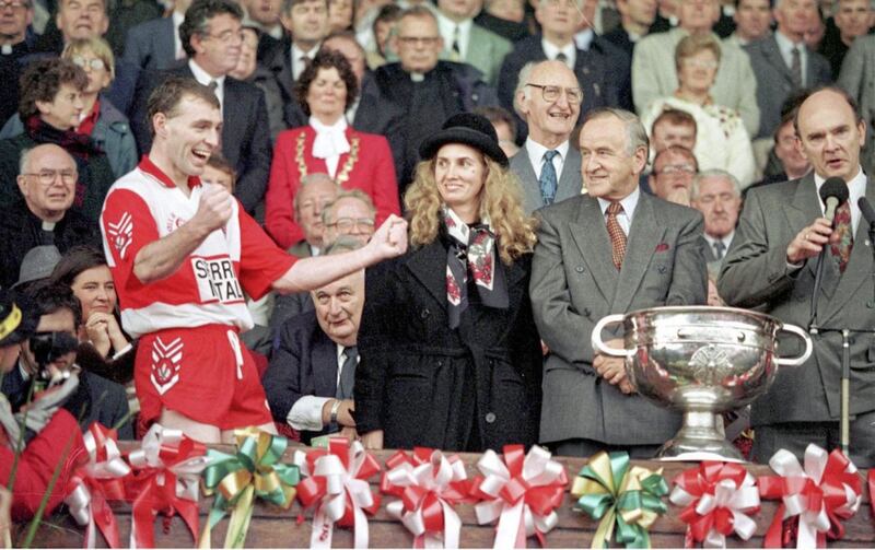 Derry captain Henry Downey prepares to raise the Sam Maguire Cup in 1993 