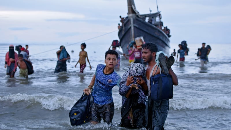 Ethnic Rohingya disembark from their boat upon landing in Ulee Madon, North Aceh, Indonesia (AP)