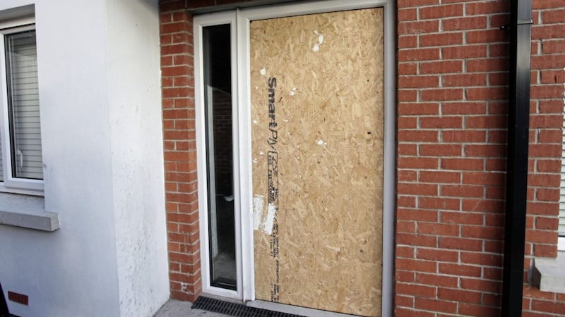 The boarded up front door following the arson attack at the house at Dunmore Walk. Picture by Ann McManus 