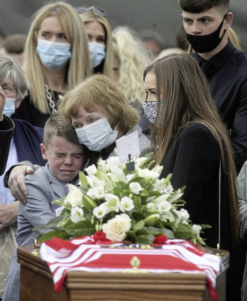 Anto Finnegan&#39;s family stand by his coffin following Requiem Mass yesterday. Picture by Hugh Russell 
