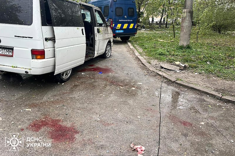 Blood next to a car damaged by a Russian missile strike in Chernihiv, Ukraine (Ukrainian Emergency Service/AP)