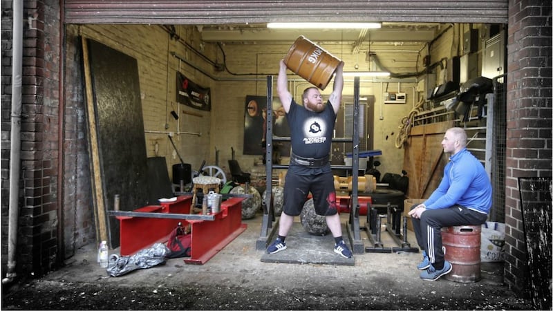 Joe Downey keeps an eye on his strongman brother Michael as they look ahead to tomorrow&#39;s Britain Strongest Man competition in Sheffield. Picture by Hugh Russell 