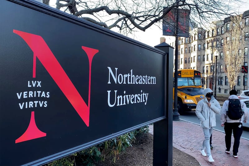 Students walk on the Northeastern University campus in Boston
