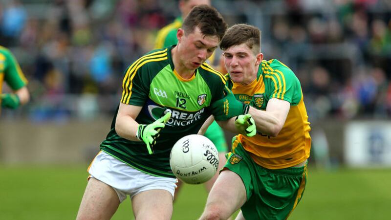 Tiarnan McAteer takes on Donegal's Paul Murphy during Antrim's MFC win in Ballybofey<br />Picture by Seamus Loughran