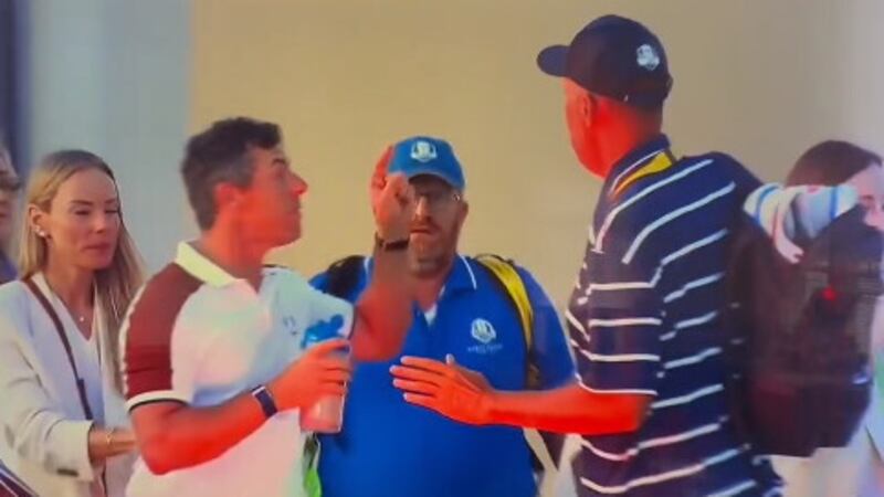 Rory McIlroy angrily confronts US caddie Jim Mackay following Saturday's play at the Ryder Cup. Picture: LifeOfTimReilly/X