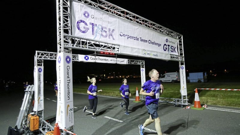 Competitors cross the line in last year&#39;s Grant Thornton runway run at Belfast City Airport, in which 600 runners took part 